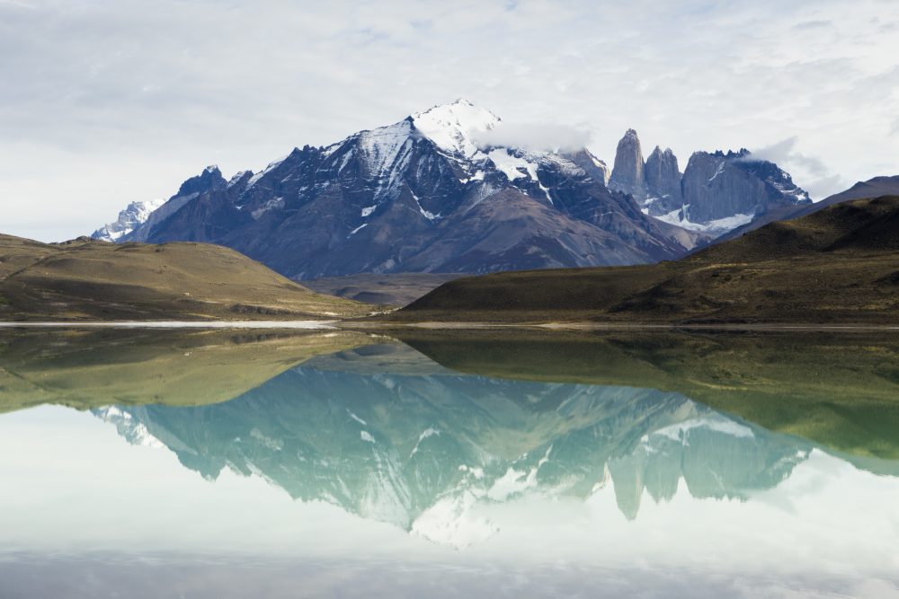 Mountains reflected in saline lake, Amarga Lagoon, Torres del Paine, Torres del Paine National Park, Patagonia, Chile